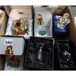 A collection of scent bottles in boxes Condition Report: Available upon request