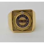 An 18ct gold gents ring to celebrate 20 years of ESSO in Malaysia, set with a diamond and enamel,