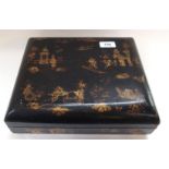 A Chinese lacquered box, the interior fitted with five further small boxes, 30cm wide overall