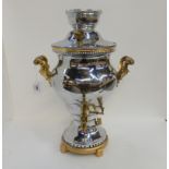A chrome plated and gilt metal samovar, 48cm high Condition Report: Available upon request