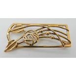 A large 9ct gold Mackintosh inspired brooch, dimensions 5cm x 2.2cm, weight 8.3gms Condition Report:
