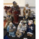 Assorted partially glazed Chinese figures Condition Report: Available upon request