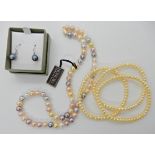 A Honora pearl necklace with a 14k gold clasp three yellow pearl bracelets and a pair of earrings