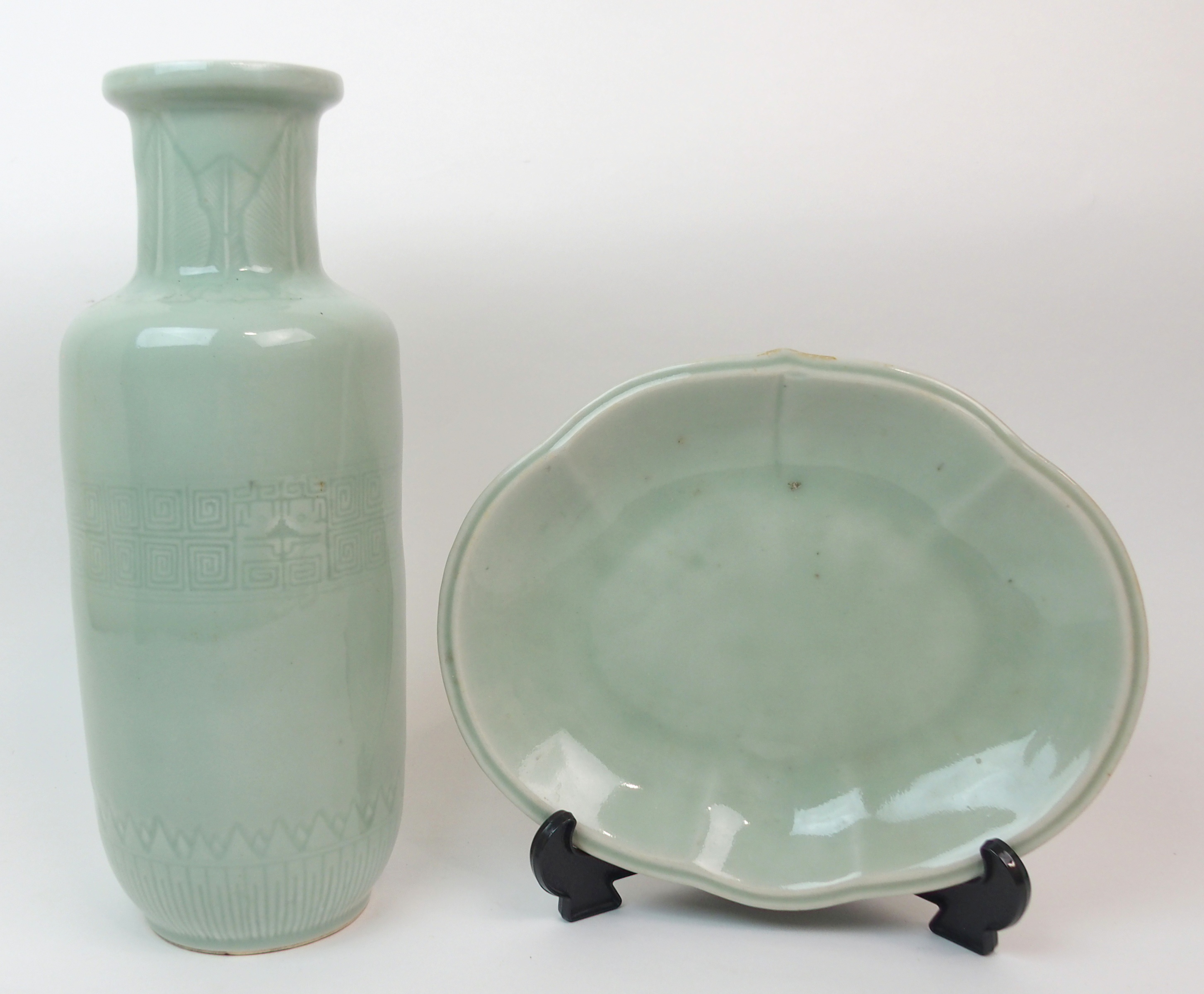 A CHINESE CELADON VASE incised with a stiff leaf band to the neck above a taotie mask and key