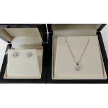 An 18ct white gold diamond flower pendant diameter 5.2mm, length of chain 46cm, with a pair of