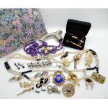 A Trifari clown brooch, collection of animal brooches, costume jewellery and a sparkly evening bag