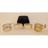 A lot comprising a cased pair of silver napkin rings, Sheffield 1996 and two silver cup holders,