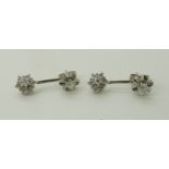 A pair of 18ct white gold diamond flower drop earrings, set with estimated approx 0.45cts of