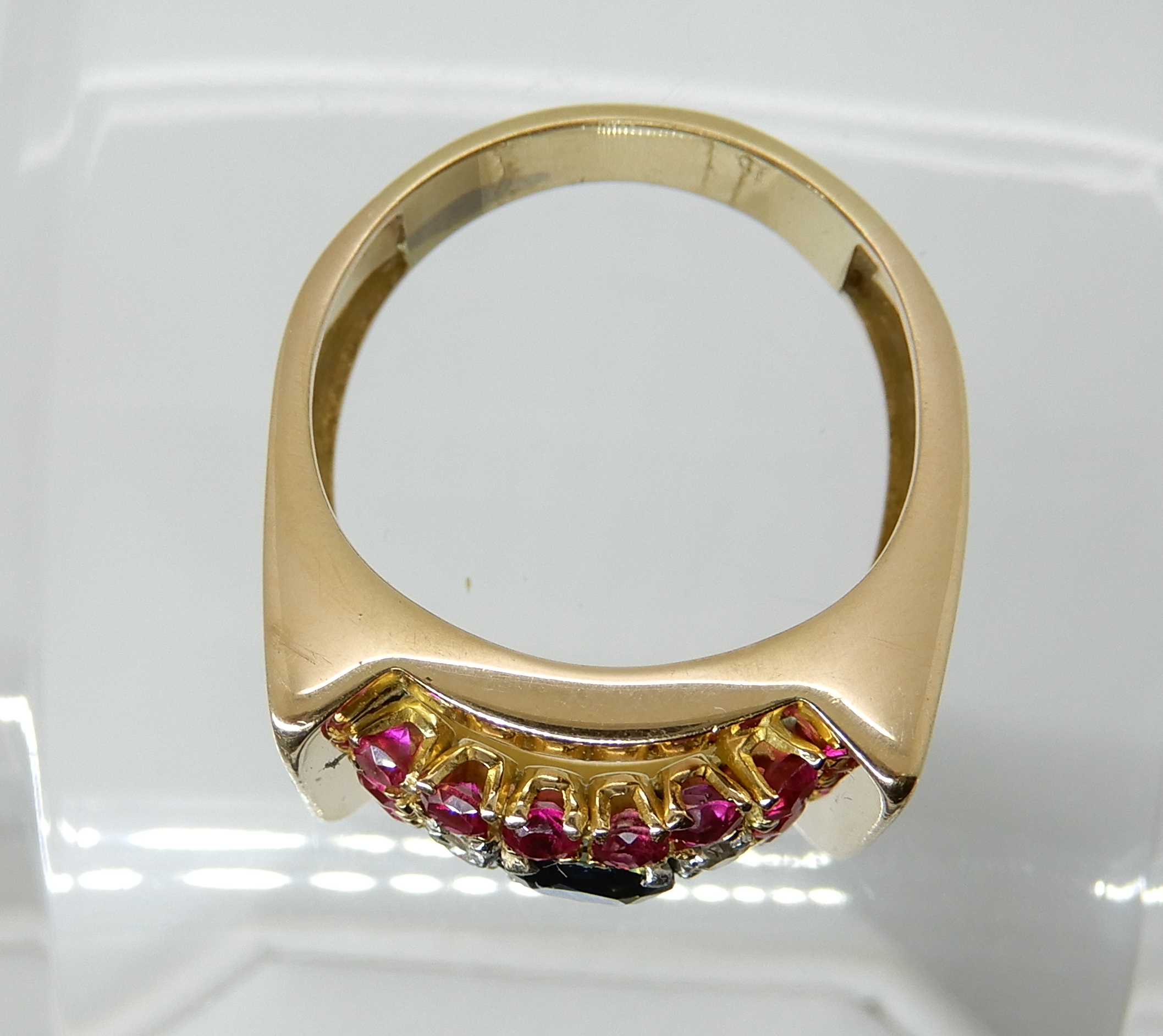 A bright yellow metal sapphire diamonds and red gem set gents ring, size U, weight 10.6gms Condition - Image 2 of 3