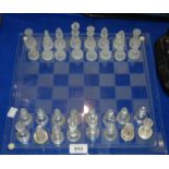 A glass chess set Condition Report: Available upon request