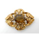 A bright yellow metal Victorian brooch set with a citrine, dimensions 6cm x 4.2cm, weight 10.6gms
