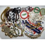 A collection of vintage costume jewellery to include, a glass flower necklace, retro items and