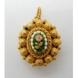 A gilded white metal filigree pomander locket with enamelled flower detail, dimensions 3.2cm x 2.