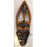 A large African carved wood mask, 77cm high Condition Report: Available upon request