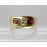 A bright yellow metal ruby and old cut diamond ring, diamond estimated approx 0.42cts with cushion