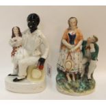 A Staffordshire figure group of 'Uncle Tom & Eva', 22cm high and another group of a courting couple,