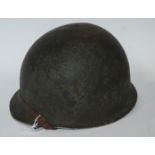An American steel military helmet Condition Report: Available upon request