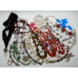 A collection of vintage costume jewellery to include a opal glass and disc pearl bracelet, six