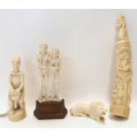 An African early 20th Century carved tusk with figures, snake and monkey, 23.5cm high, another