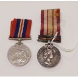 An Elizabeth II general service medal with Near East clasp to 938164 E Hughes A.B.R.N. and a WWII