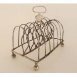 A silver toastrack, rubbed makers marks, London 1807, 243gms Condition Report: Available upon