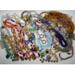 A collection of vintage costume jewellery to include, shell beads, good glass beads, and necklaces