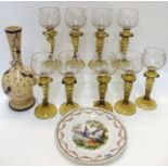 A set of nine hock glasses, with engraved star decoration to bowls, (one chipped to rim),