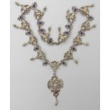 A white metal and enamel Gothic Revival cherub necklace, highly detailed cherub links, with blue