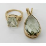 A 9ct gold green amethyst pendant with matching ring size O Condition Report: light general wear.