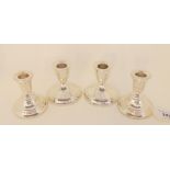 A lot comprising a pair of silver candlesticks, Birmingham 1925 and a sterling silver pair (