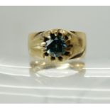 A 9ct gold ring set with an estimated approx 1ct blue diamond, size V, weight 7.8gms Condition
