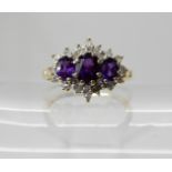 A 9ct gold amethyst and diamond cluster ring, size N1/2, weight 2.1gms Condition Report: Available