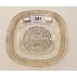 A silver dish, London 1966, commemorating the centenary of the Nestle Company, 13cm square, 109gms