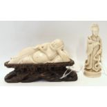 A Chinese early 20th Century carved ivory reclining Buddha, on wood stand, 13cm wide and an ivory
