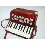 A Chinese accordion on original box Condition Report: Available upon request