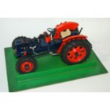 A Dugu model tractor with original box cover, tri-ang Mimic boat, Jack in the boat (def) etc