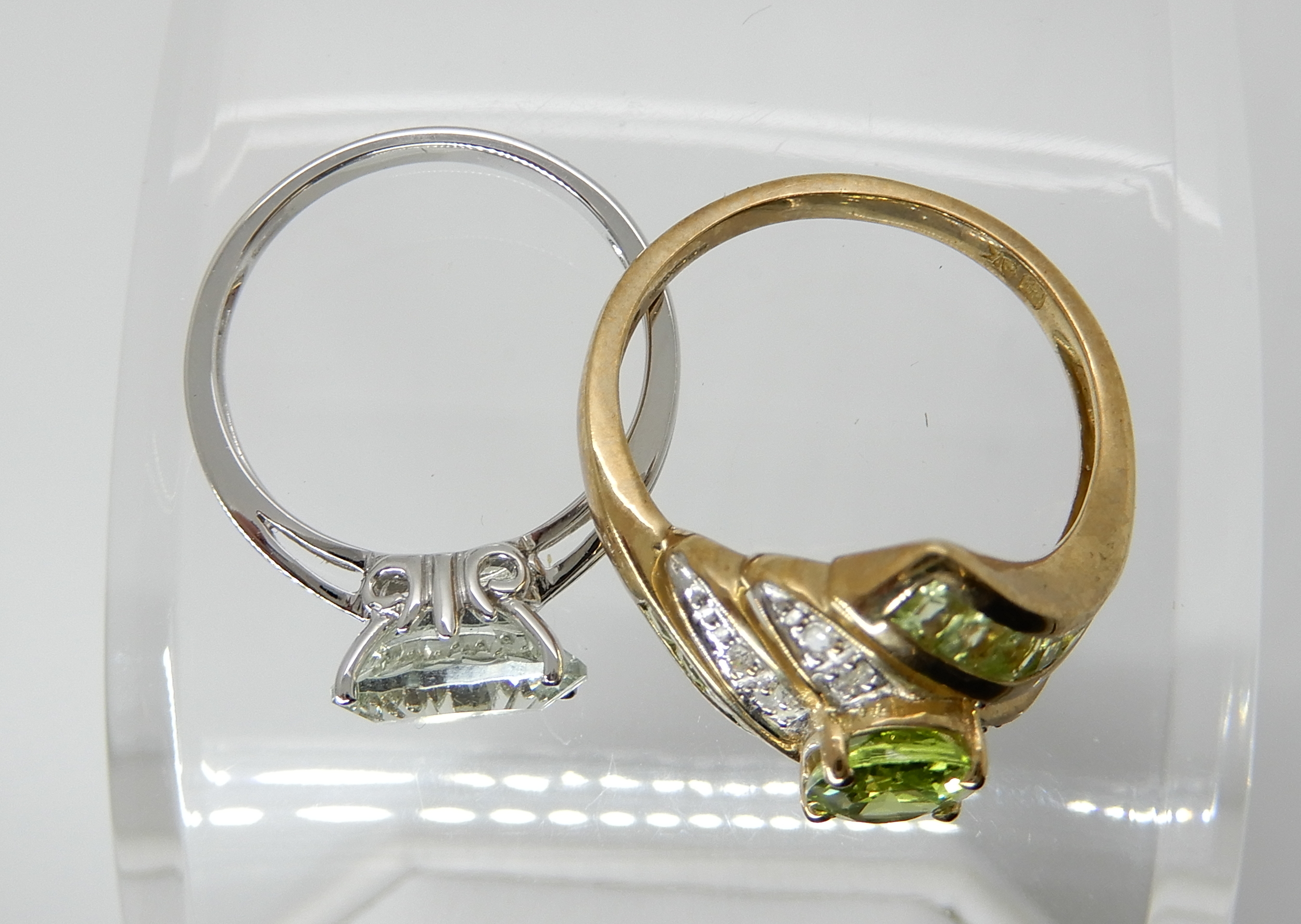 A 9ct gold peridot and diamond dress ring size Q1/2 and a 9ct white gold pale blue gemstone ring, - Image 2 of 3