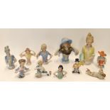 Nine German porcelain half dolls, largest 12cm high and two bisque figures (11) Condition Report: