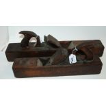 A large McAlpine wood plane, 54cm long and a Porteous wood plane, 44cm (2) Condition Report: