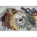 A collection of vintage costume jewellery to include, a 60's statement necklace, good beads,