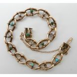 A 9ct gold fancy link bracelet set with turquoise and pearls (two pearls missing) length 20.5cm,