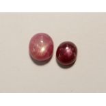 Two loose star rubies size 7.3mm x 6.4mm x 4.4mm, smaller and redder 6.2mm x 5.4mm x 3.8mm Condition
