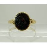 An 18ct gold intaglio monogrammed bloodstone signet ring size Q1/2, weight 2.6gms Condition