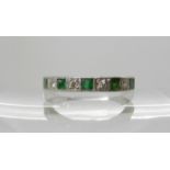 An 18ct white gold emerald and diamond half eternity ring, size Q1/2, weight 4gms Condition