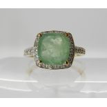 A 9ct gold diamond and pale green emerald ring, finger size O, weight 2.1gms Condition Report: