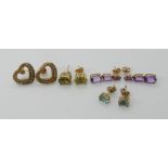A pair of 9ct peridot stud earrings and three other pairs of gold and yellow metal earrings,