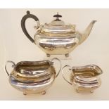 A three piece silver tea service by James Dixon and Sons, Sheffield 1906, of rounded rectangular
