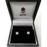 A pair of 18ct white gold diamond stud earrings, retailed by Mappin & Webb, both diamonds 0.50cts