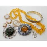 A Scottish agate inlaid brooch, a John Hart silver and hardstone set brooch, a silver bangle and