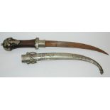 A white-metal ethnic dagger in metal scabbard, 43cm high Condition Report: Available upon request